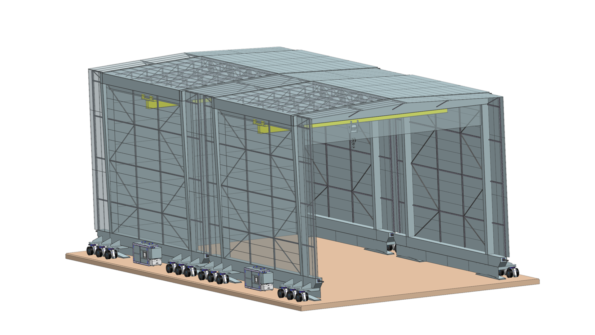 zwei mobile werkhallen anenandergekopplet. Werhallen sind auf reifen montiert und haben eigene Brückenkrane